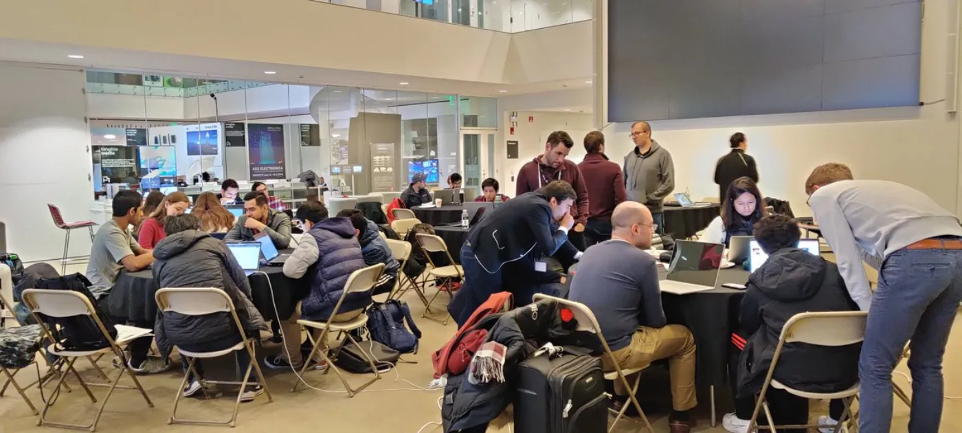 Teams collaborate on project work during the final day of the AI Latin American SumMIT Hackathon.