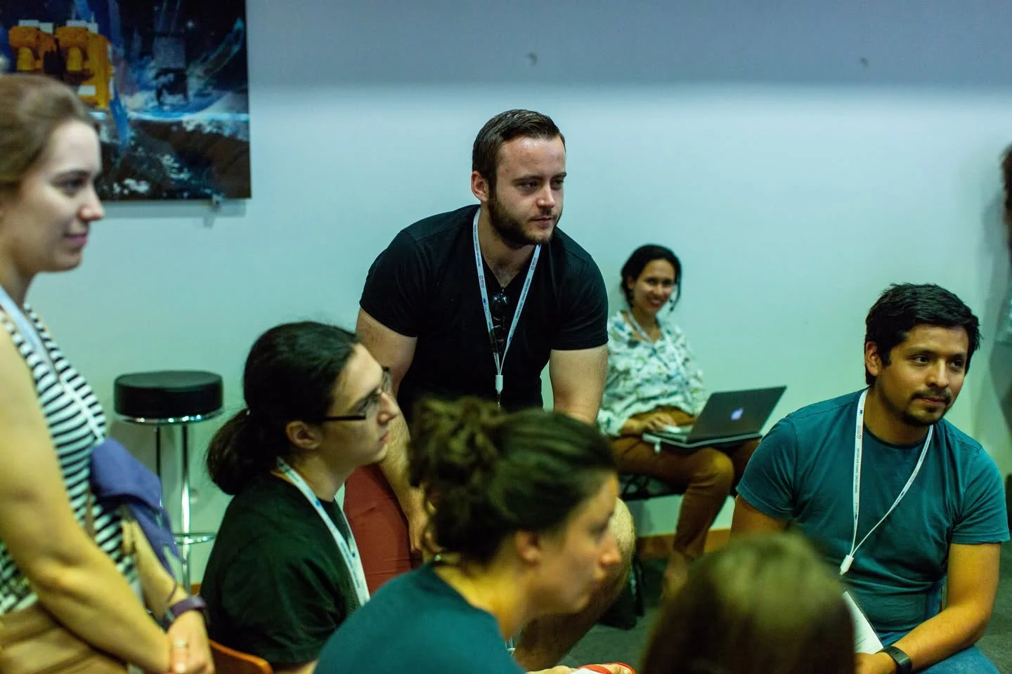 A small group of attendees sharing a conversation at a table during ESOF 2018 in Toulouse, France.