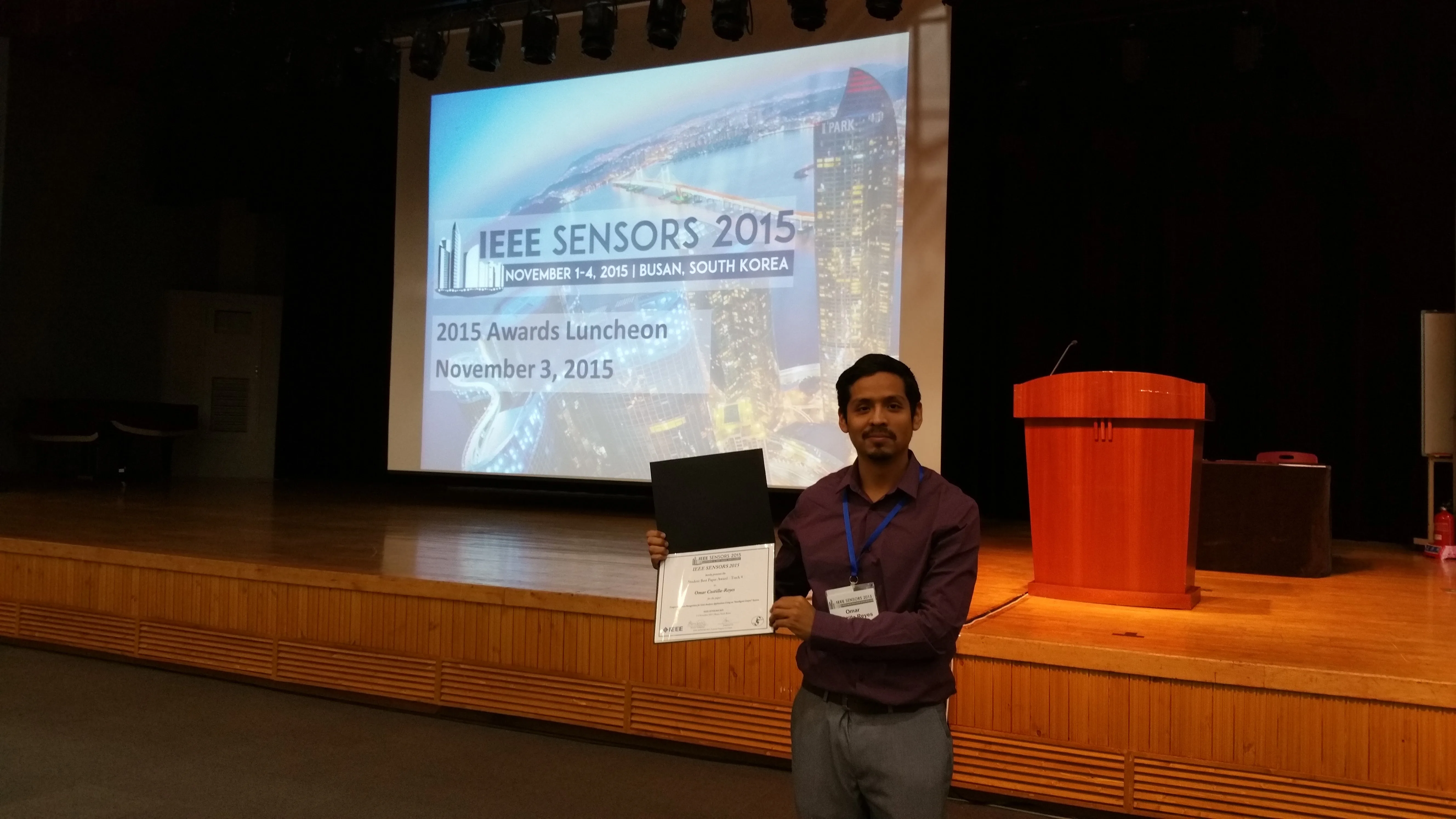 Dr. Omar Costilla Reyes holds his IEEE SENSORS 2015 award certificate at BEXCO in Busan, South Korea, on November 3, 2015.