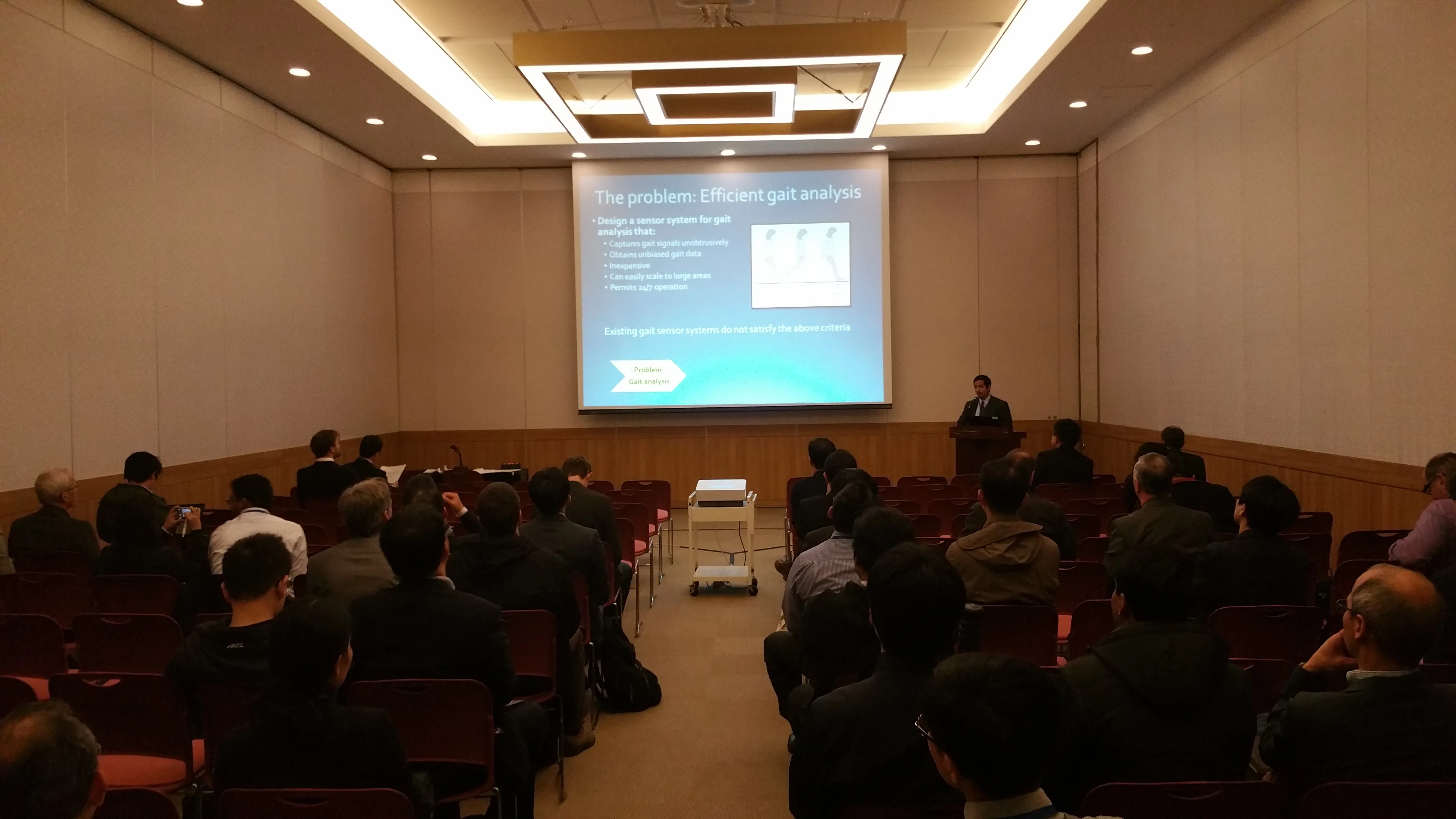 Dr. Omar Costilla Reyes presents a gait analysis research slide to conference attendees at BEXCO in Busan, South Korea, on November 2, 2015.