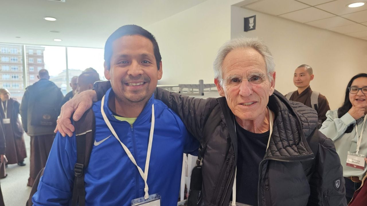 Dr. Omar Costilla Reyes and Jon Kabat-Zinn, developer of Mindfulness-Based Stress Reduction, stand together at a Harvard symposium.