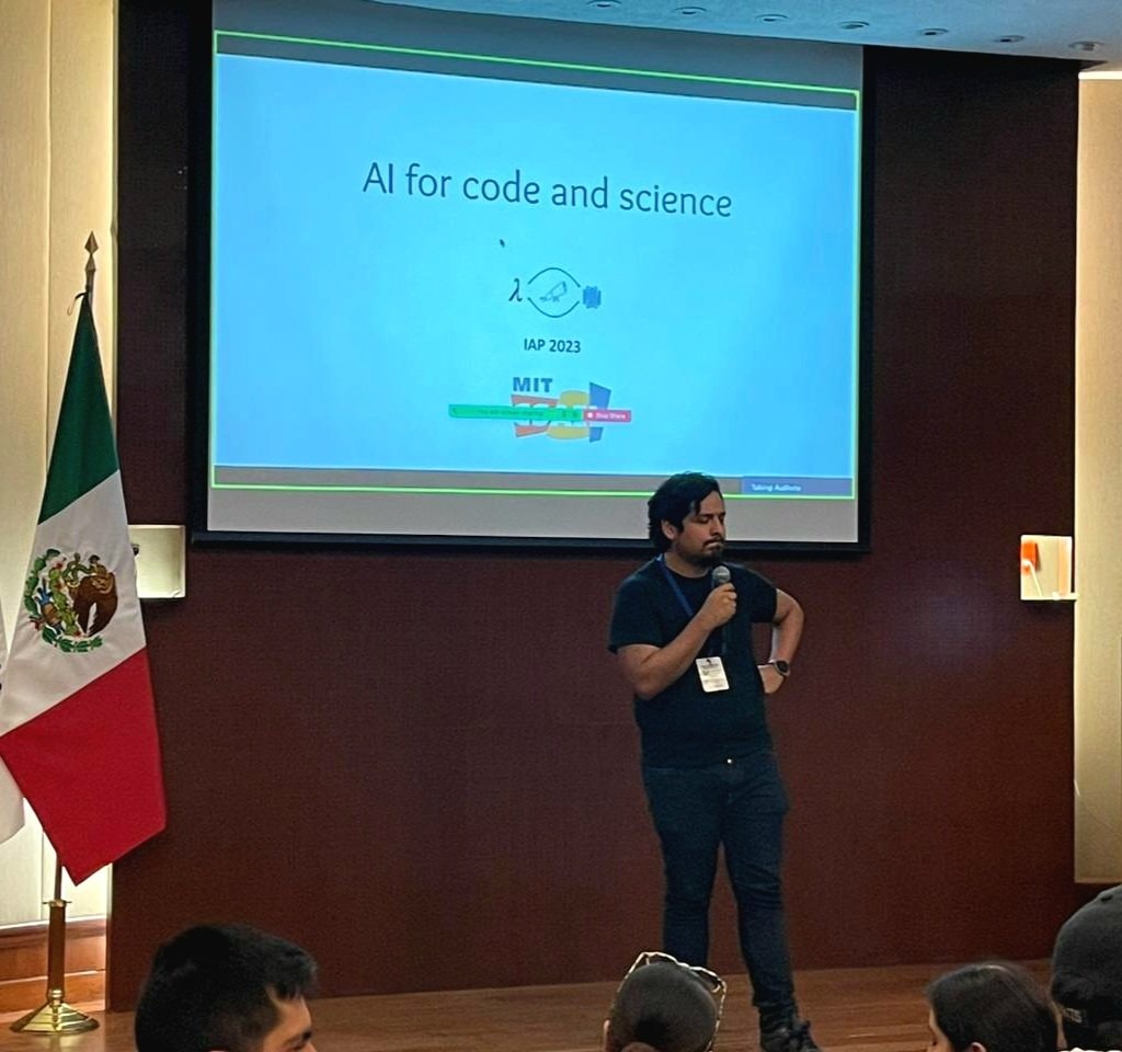 Dr. Omar Costilla Reyes speaking at a Tecnológico de Monterrey masterclass on AI for code and science.