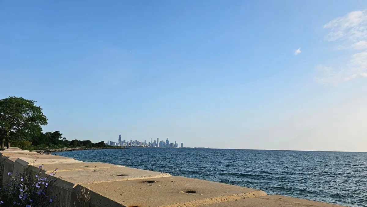 The Chicago skyline across Lake Michigan from the waterfront path.