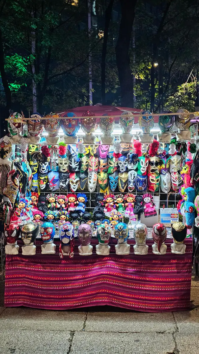 A colorful stall of Mexican luchador masks along Paseo de la Reforma.