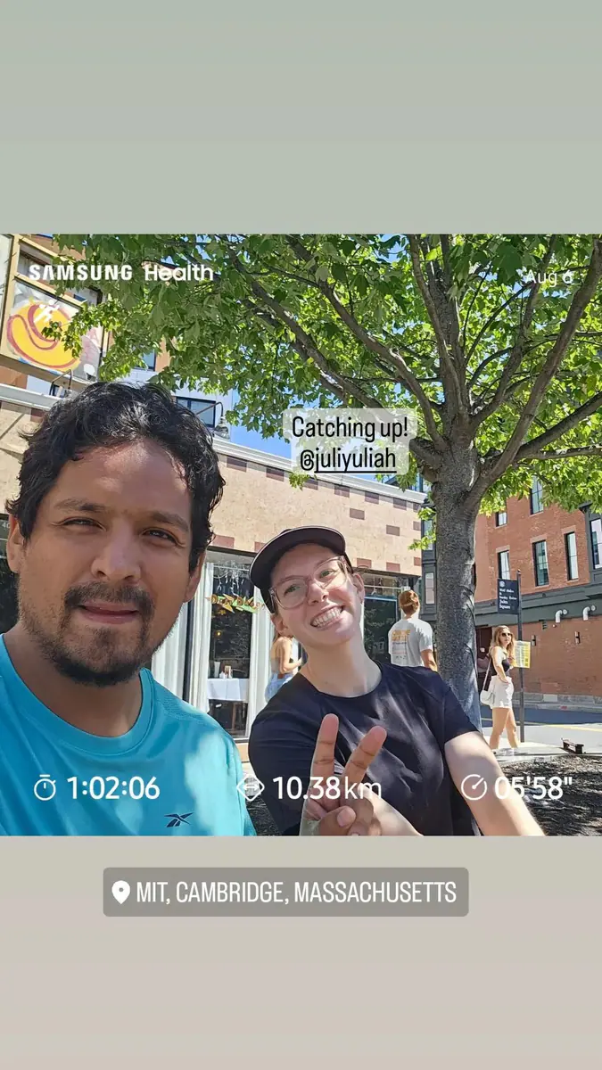 Omar and a friend after a run near MIT, with the workout summary overlaid.