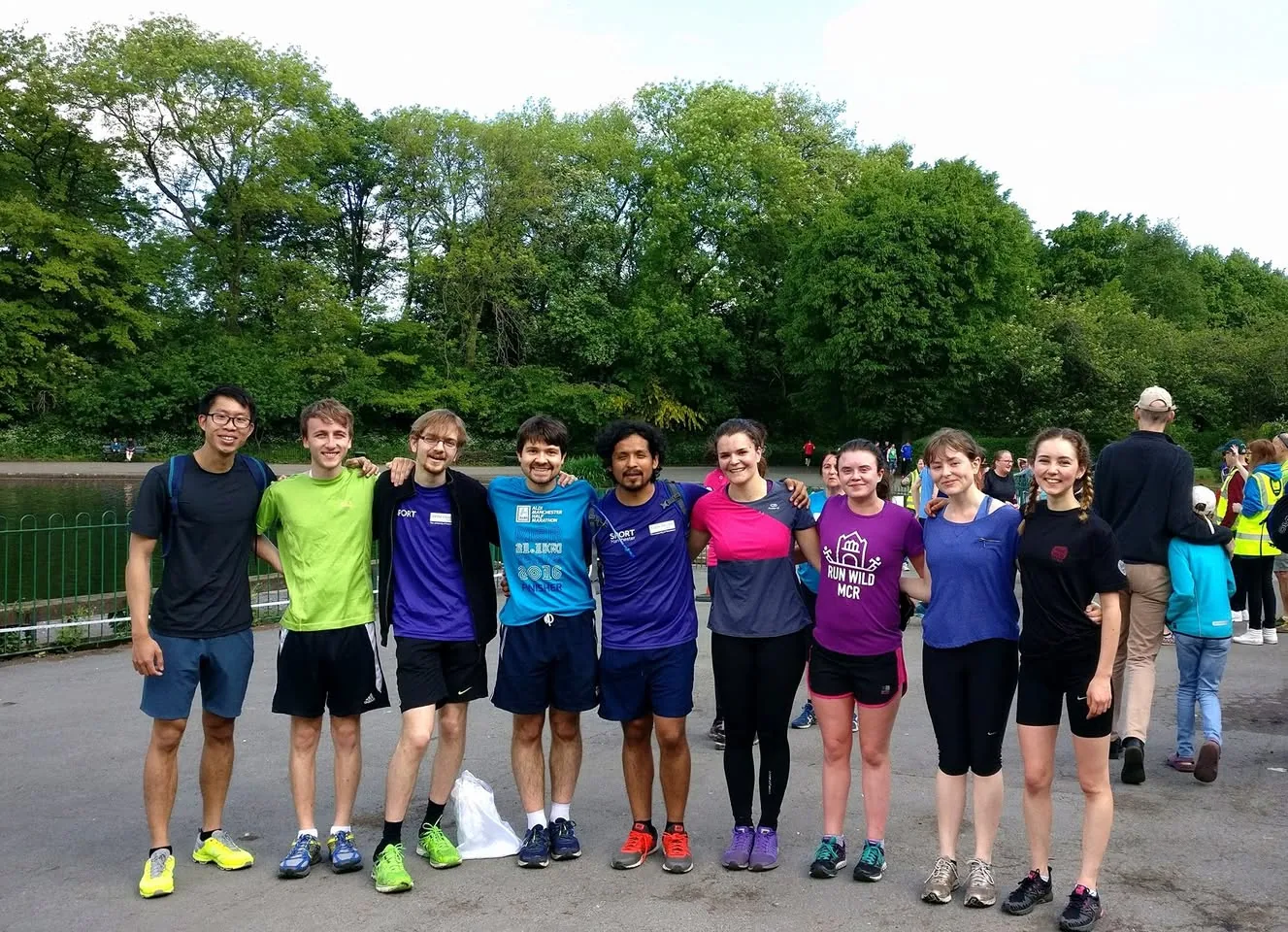 A group of running friends celebrating a 50th parkrun milestone in 2017.