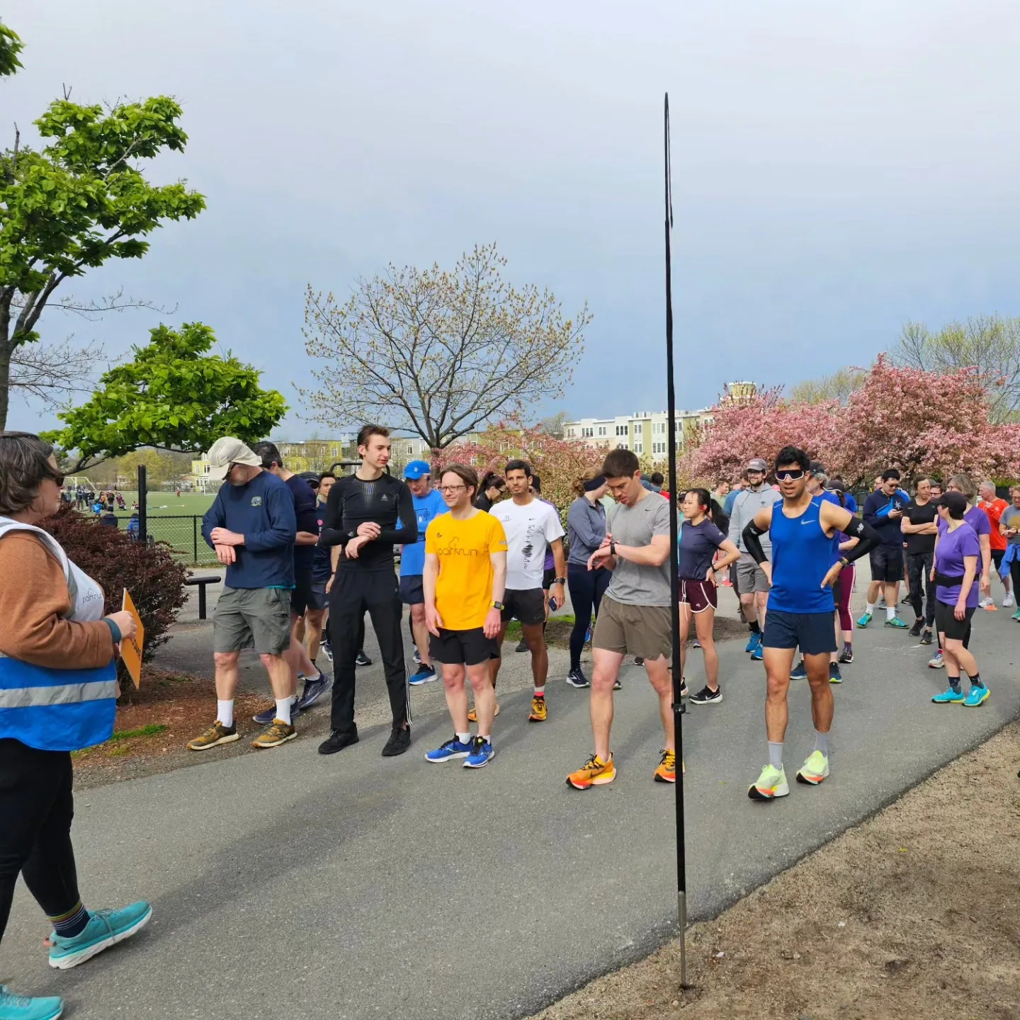 A group of parkrun volunteers and runners together in 2023.