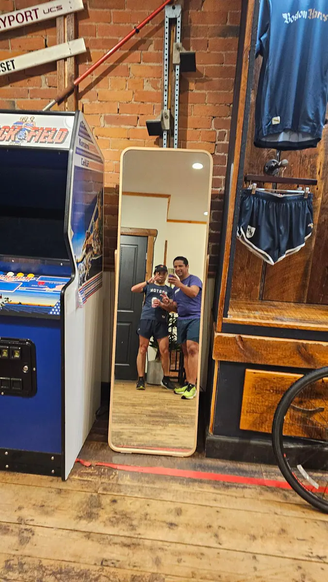Two friends share a mirror photo at Track House in Boston.
