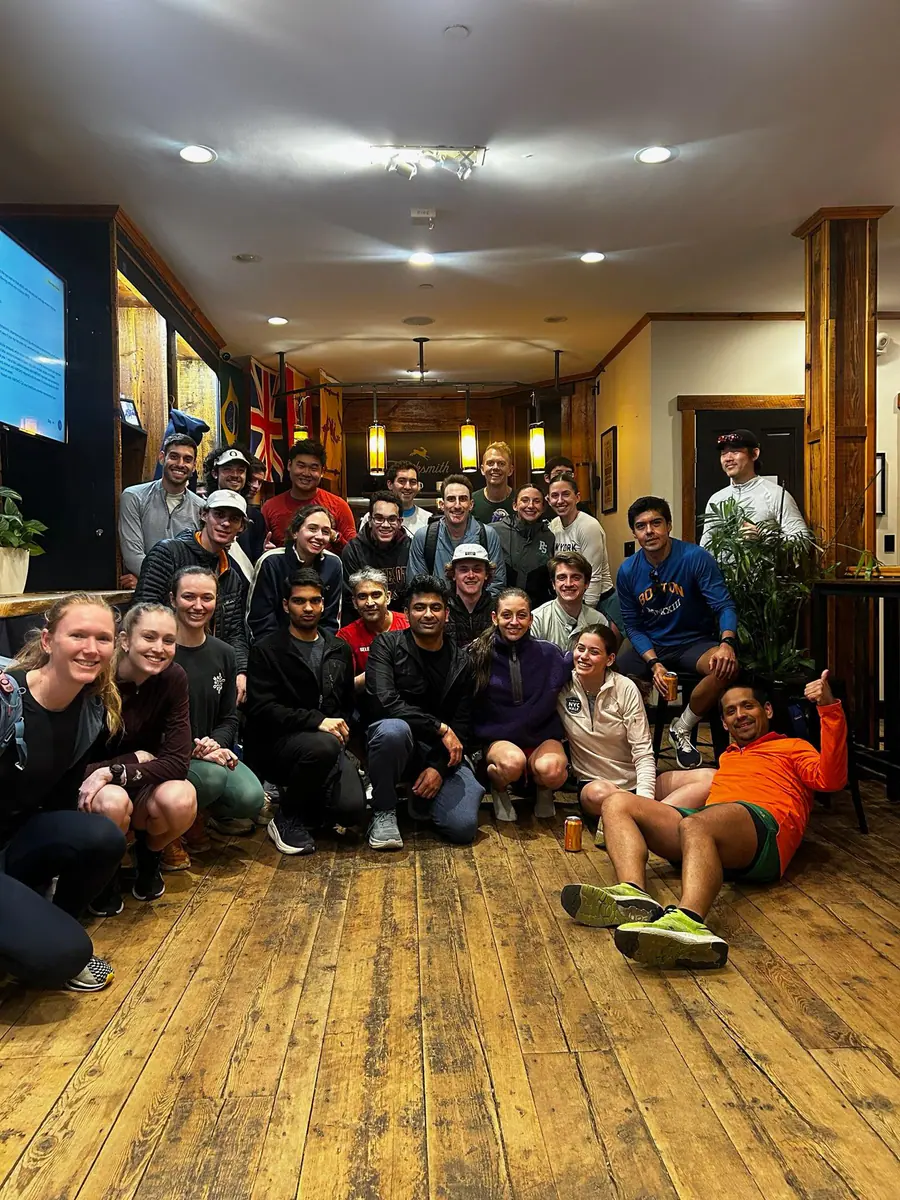 A Tracksmith Boston running group gathered indoors.