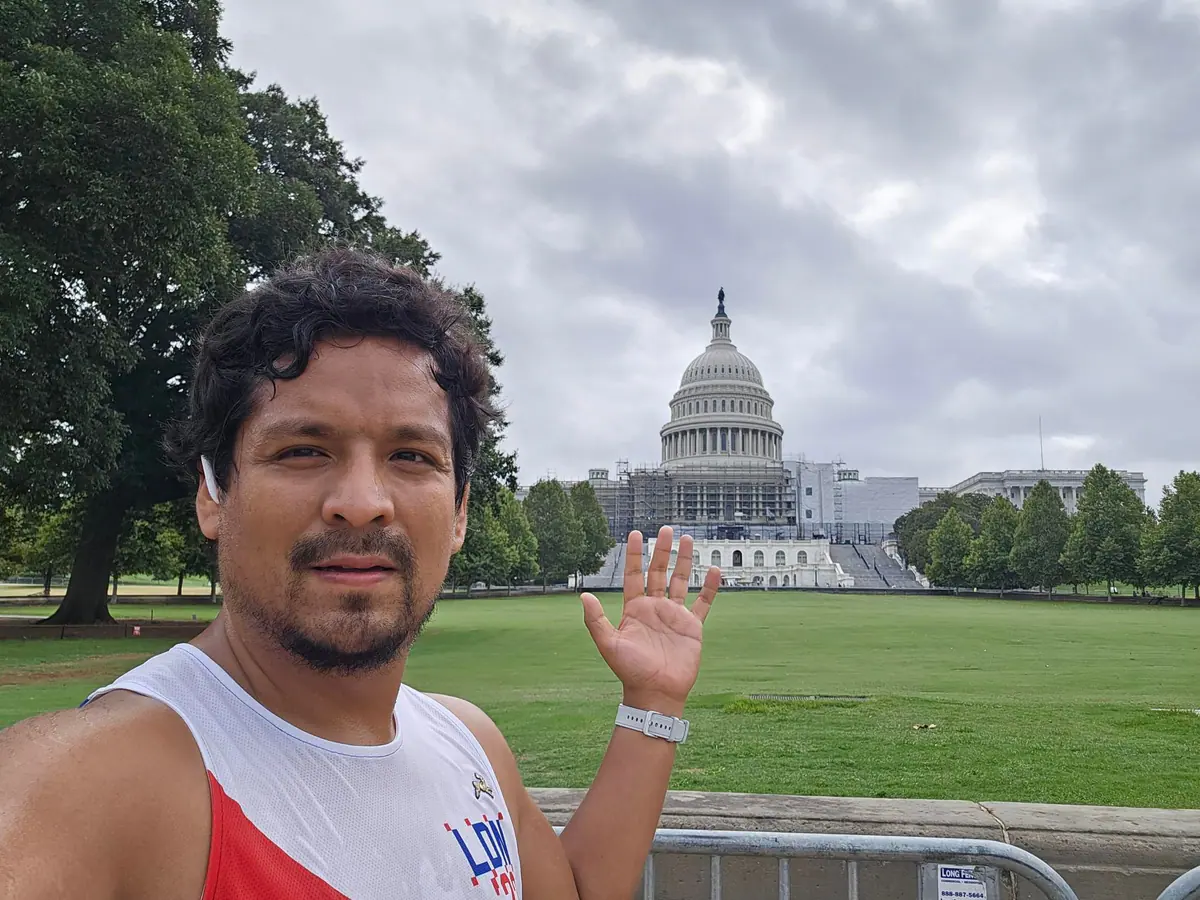 Omar in running gear in front of the U.S. Capitol after a Washington, DC run.